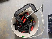 Top view of bucket showing assorted clamps