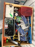 Drawer containing assorted tools and hardware