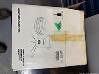 Box exterior showing illustration and importer information