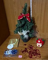 Full lot: tree, Santa ornament, gift box, snowflake ornaments, red garland