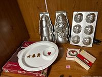 Overall lot showing aluminium pans, ceramic platter, small boxed items