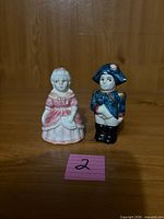 Front view of both figural shakers