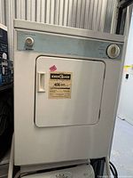 Front view of Kenmore portable heavy-duty dryer showing control panel, door, and EnerGuide label