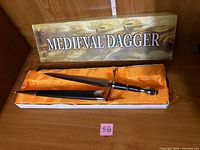 Dagger in satin-lined box with sleeve overtop