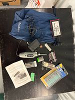 Entire lot overview including rotary tool, adapter, accessory sets, bag, vials and case