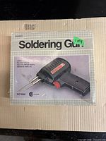 Box top showing model, 100 W rating