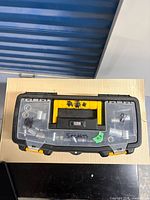 Closed toolbox showing clear lids with sockets visible