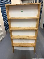 Front view showing entire bookshelf and five shelves