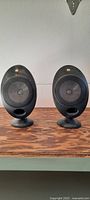Front view of both KEF HTS2001 speakers on bases