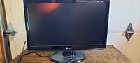 Front view of LG W2353V-PF monitor on stand, screen off