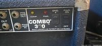Front control panel showing Combo 300 branding, inputs, compression/power LEDs, power switch