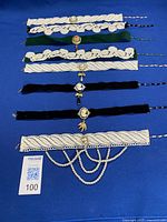 Group shot of eight handmade choker necklaces