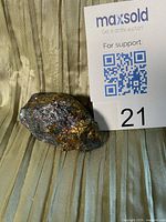 Front view of iridescent chalcopyrite specimen with lot card