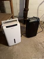 Waykar and Bionaire dehumidifiers side by side