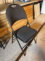 Folding chair open showing seat and back