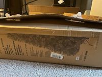 Full view of boxed tree showing product panel and size