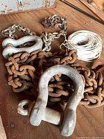 Chains, shackles and wire on workbench