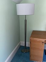 Full view of floor lamp showing shade, pole, and base