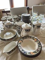 Overview of entire Garden Harvest dinnerware and goblets on table