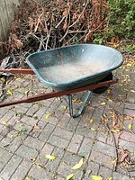 Overall view of fibreglass wheelbarrow on patio