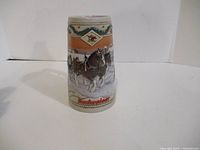 Front of Budweiser stein showing Clydesdale team scene