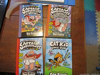 Four Dav Pilkey hardcover books displayed on table