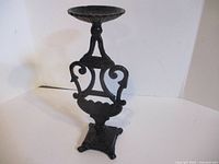 Front view showing full height and ornate scrollwork