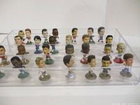 Full view of all figurines in clear display case