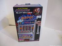 Box front showing electronic arcade slot machine graphics