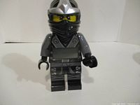 Front view showing Ninjago minifigure clock with LCD display