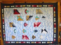 Full view of quilt showing size, pattern and borders