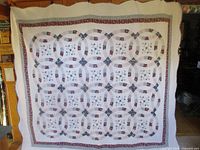 Full view of quilt displayed vertically