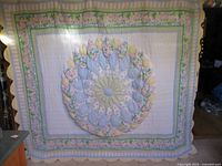 Full view of patchwork quilt hanging, showing overall design and size