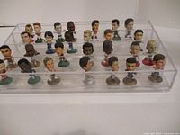 front angled view showing full set of figurines in display case