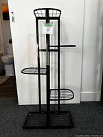 front view of black 5-tier metal plant stand