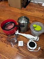 Group shot showing all items: compost bin, salad spinner, mixing bowls with strainer, hand blender, measuring cup, mug warmer