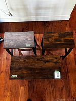 Top view of three wood surfaces showing size comparison between two stools and shoe rack