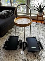 Side table and two couch arm trays on rug