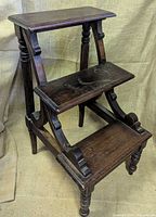 Full view of three-step wooden library ladder