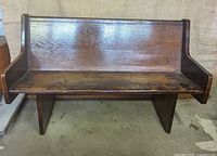 Front view of wood church pew showing full dimensions and wear