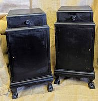 Front view of both nightstands showing drawer, door, paw feet