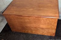 Full view of closed pine chest top and front