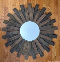 Front view of rustic wood sunburst mirror