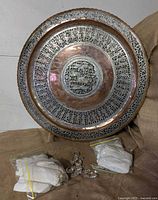 Full view of pierced copper tray and bags of chandelier prisms