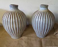 Front view of both glazed ceramic vases