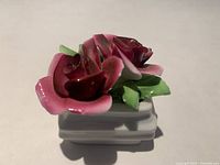 Front view of bone china rose figurine