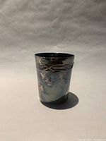 Front view of French silver alloy cup with wire band near rim