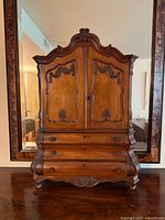 Frontal view of miniature Baroque walnut cabinet showing overall form