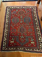 Full view of Persian prayer rug showing field, borders and fringes