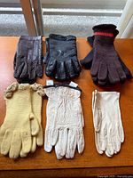 Group shot of all six pairs of gloves arranged on table
